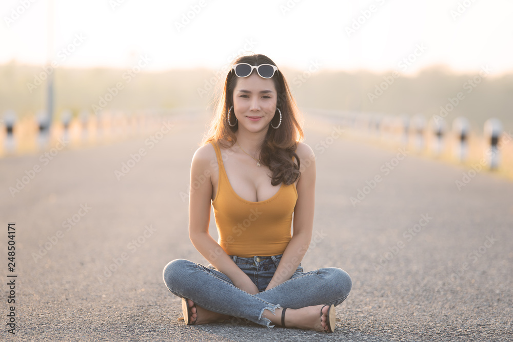 Portrait of beautiful asian woman at the field on sunset,Thailand people