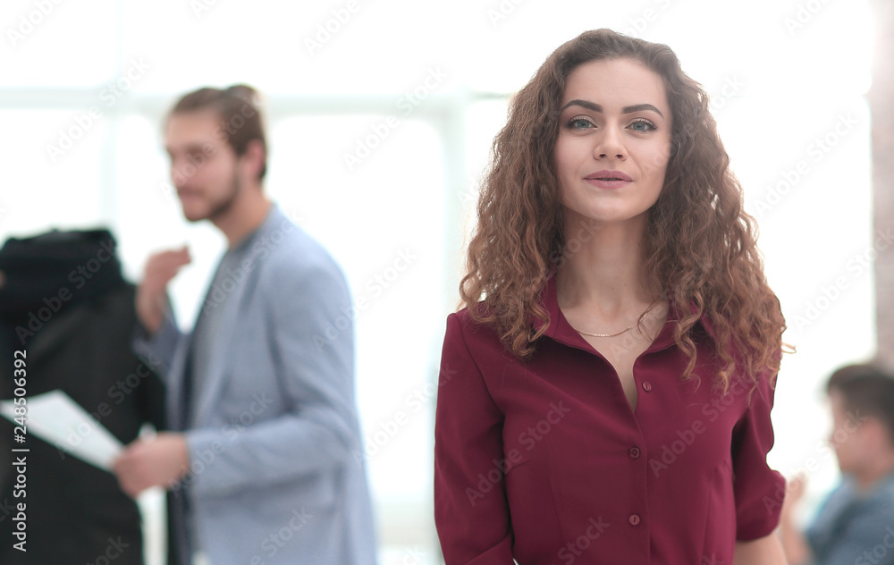 fashion designer standing in a creative Studio.p