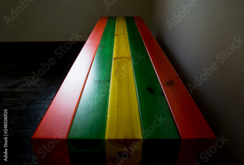 Colourful painted stripy bench seat