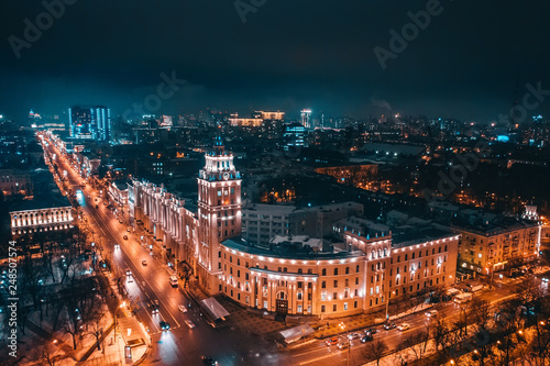 Night Aerial Voronezh city panorama. South-Eastern Railway Building with tower - symbol of Voronezh and car traffic on illuminated urban roads