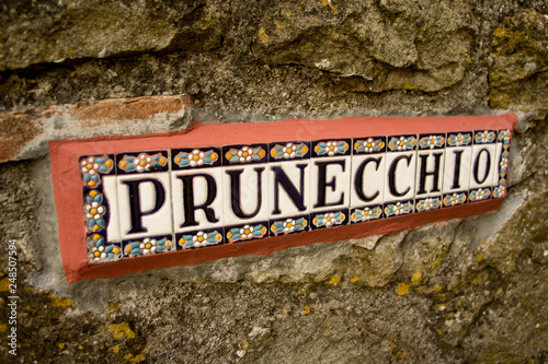 Pruneccio, Tuscany, Italy - May 27 2019: Beautiful handmade colourful tiled sign