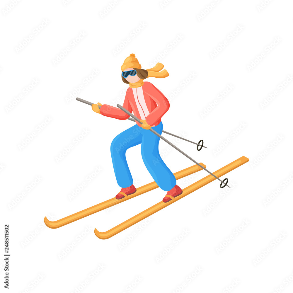 Young woman quickly skiing down the hill