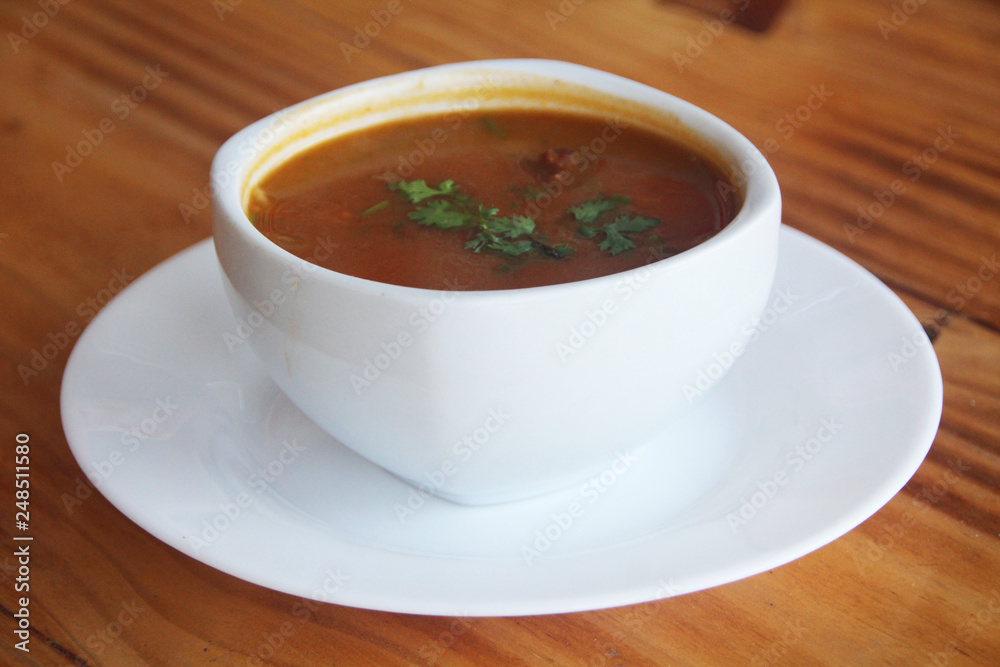 close up soup, wooden table close up soup, wooden table