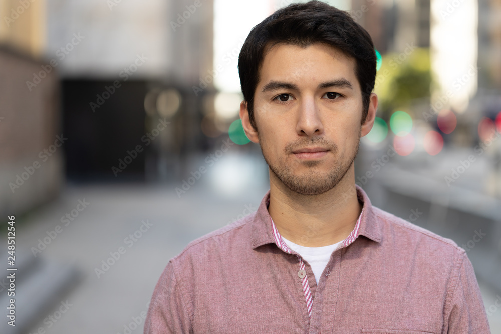 Young man in city serious face portrait Young man in city serious face portrait