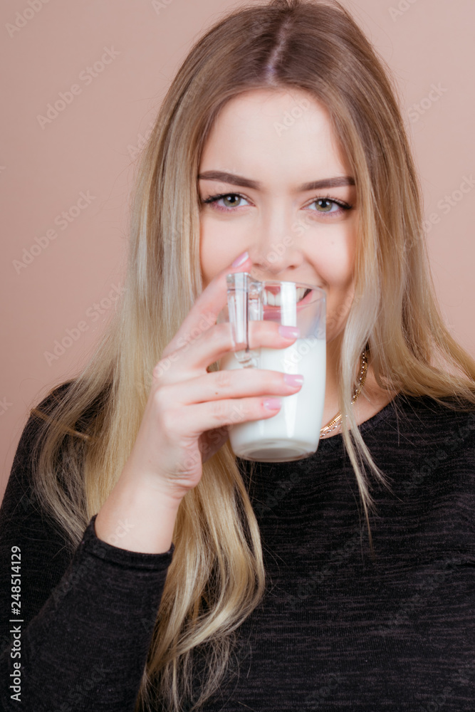 girl drinks milk and is happy girl drinks milk and is happy