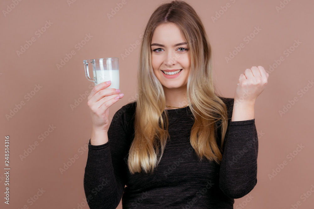 girl drinks milk and is happy
