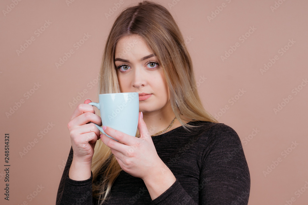 girl with a cup of tea and coffee