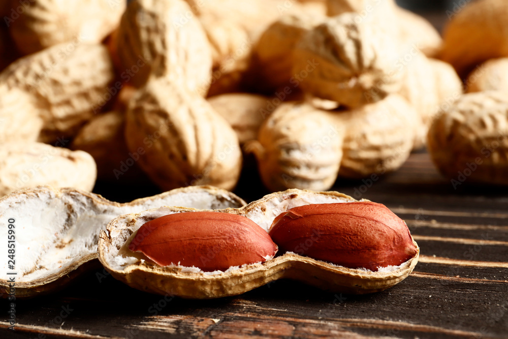 peanuts on a wooden table. Place for text. Top view. close-up peanuts on a wooden table. Place for text. Top view. close-up