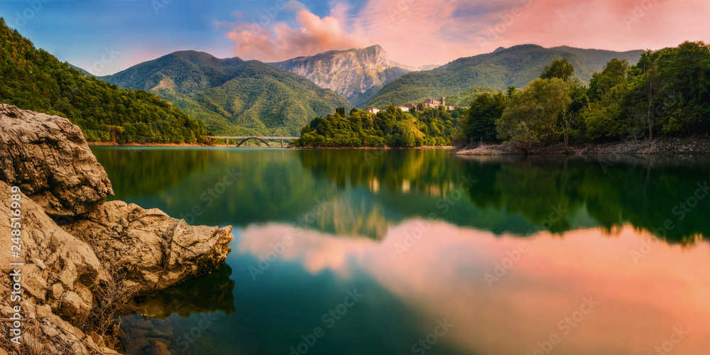 Sunset over the artificial lake in Vagli, Tuscany, Italy