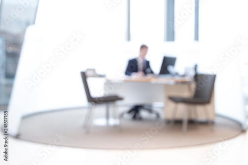 office worke space blur background, blurred office background , office worker at the computer, working day © gargantiopa