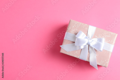 Gift box on color background and space for text. Top view © Atlas