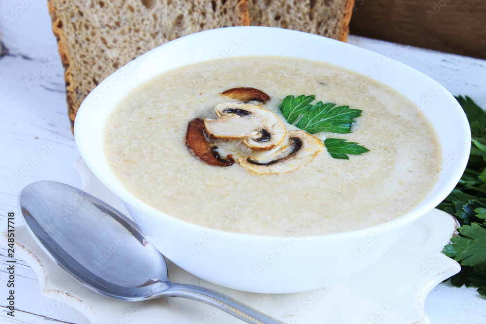 Mushroom cream soup with champignons. Close-up. Mushroom cream soup with champignons. Close-up.