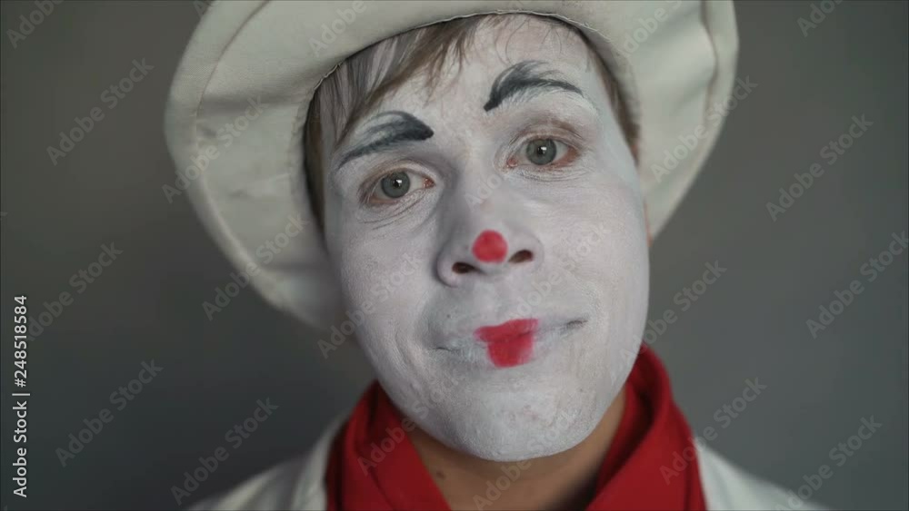 Very cute pantomime close up. Closeup portrait of a cute guy. A handsome guy mime smiles. Very cute pantomime close up. Closeup portrait of a cute guy. A handsome guy mime smiles.