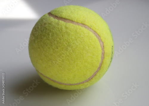 Tennis ball isolated over white background photo