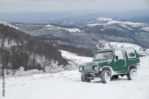 Jeep in mountain in winter
