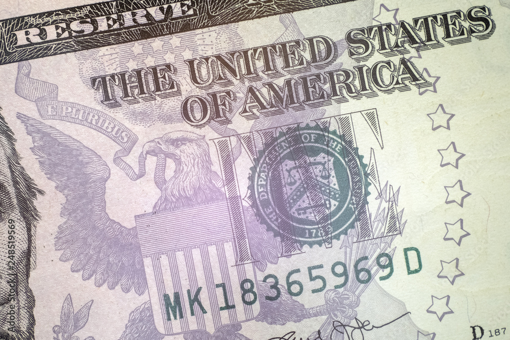 Macro. Fragment of the front side of the 5 dollar bill of the USA with