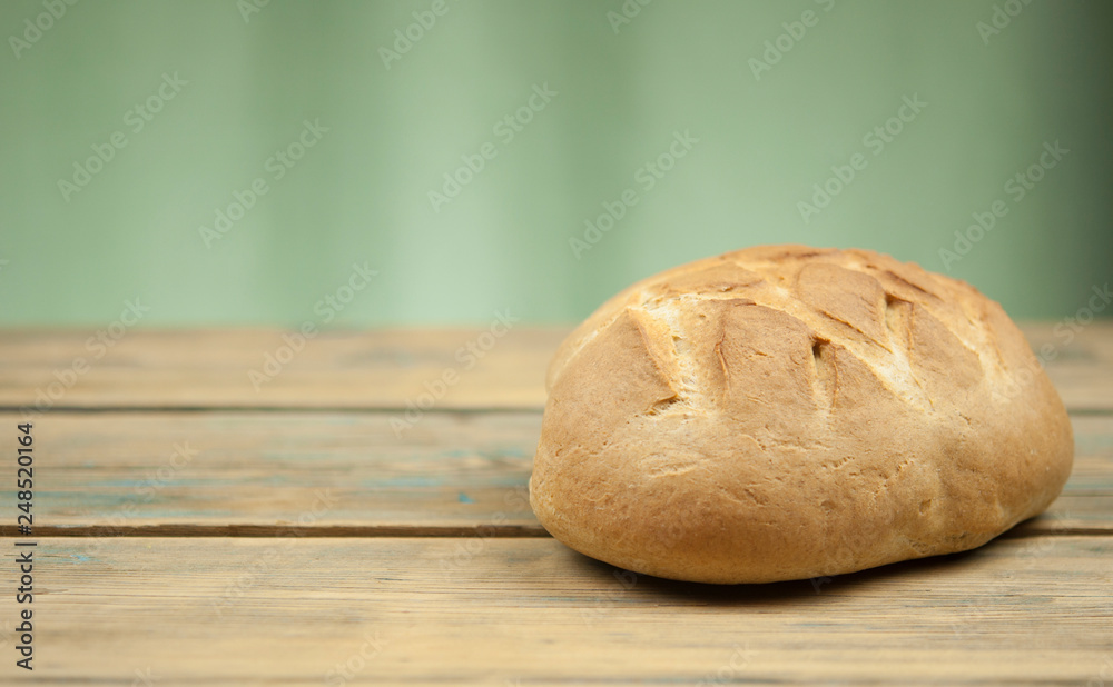 freshly baked sliced bread on wooden table