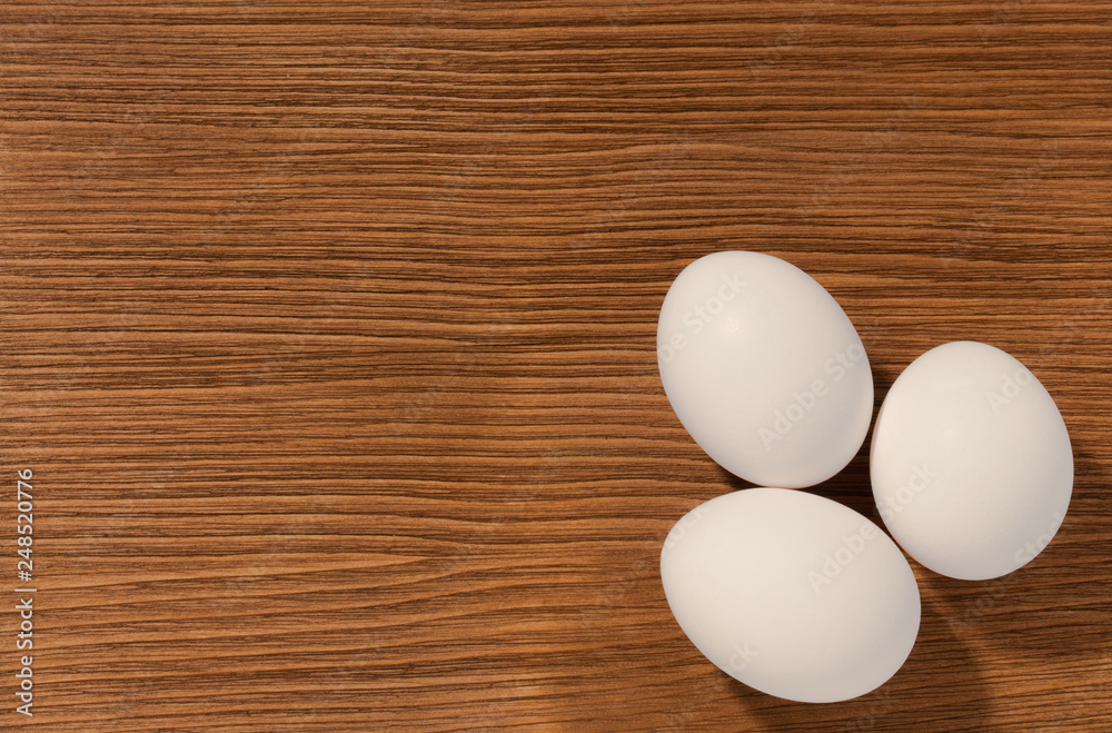 eggs on brown wooden background