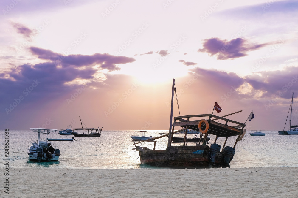 Silhouette of a wooden boat on the beach against the backdrop of a beautiful romantic sunset Silhouette of a wooden boat on the beach against the backdrop of a beautiful romantic sunset