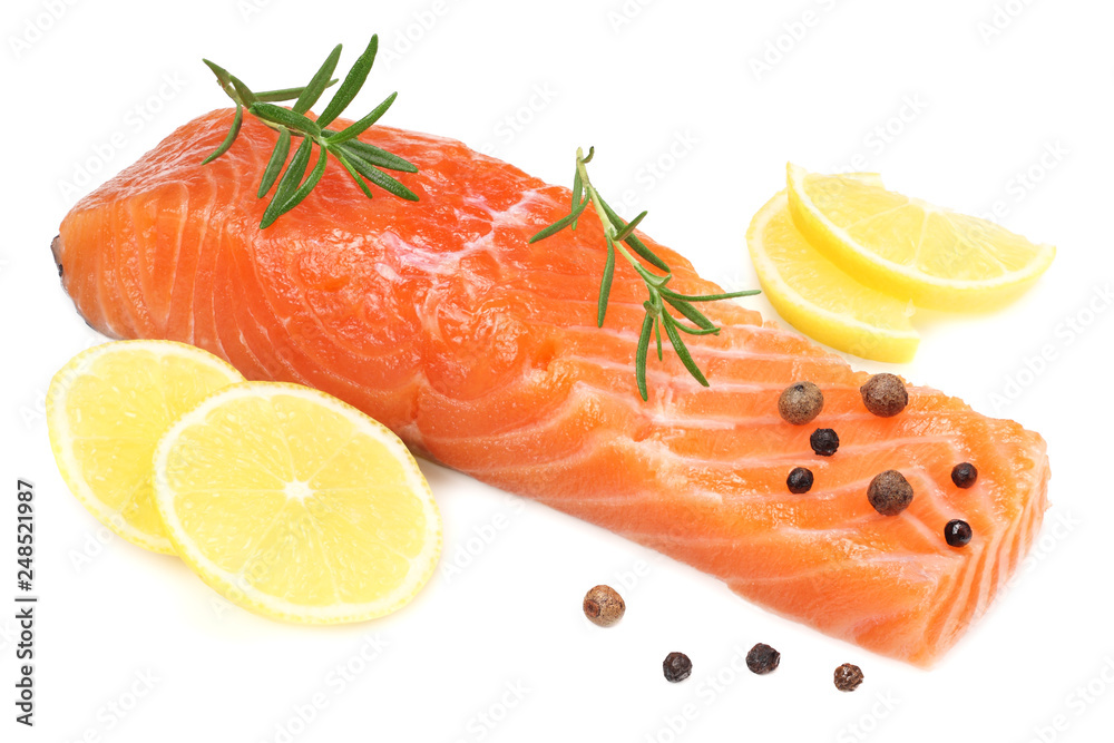 Red fish. Raw salmon fillet with rosemary and lemon isolate on white background. Red fish. Raw salmon fillet with rosemary and lemon isolate on white background.