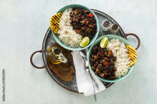 Canvas Print Cuban rice and black bean dish with grilled pineapple
