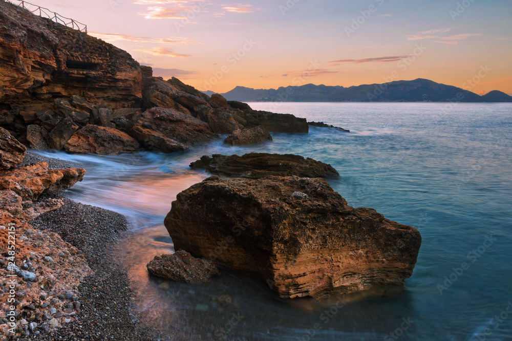 Beautiful view of rocky beach during sunset.