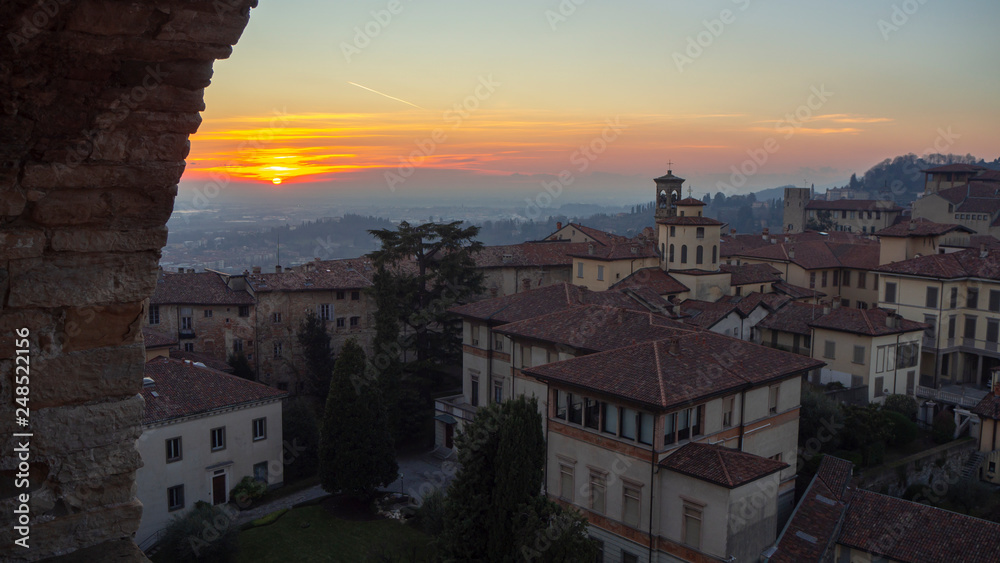 Bergamo, Italy. The old town. Sunset from the bell tower to the city and to the Po valley