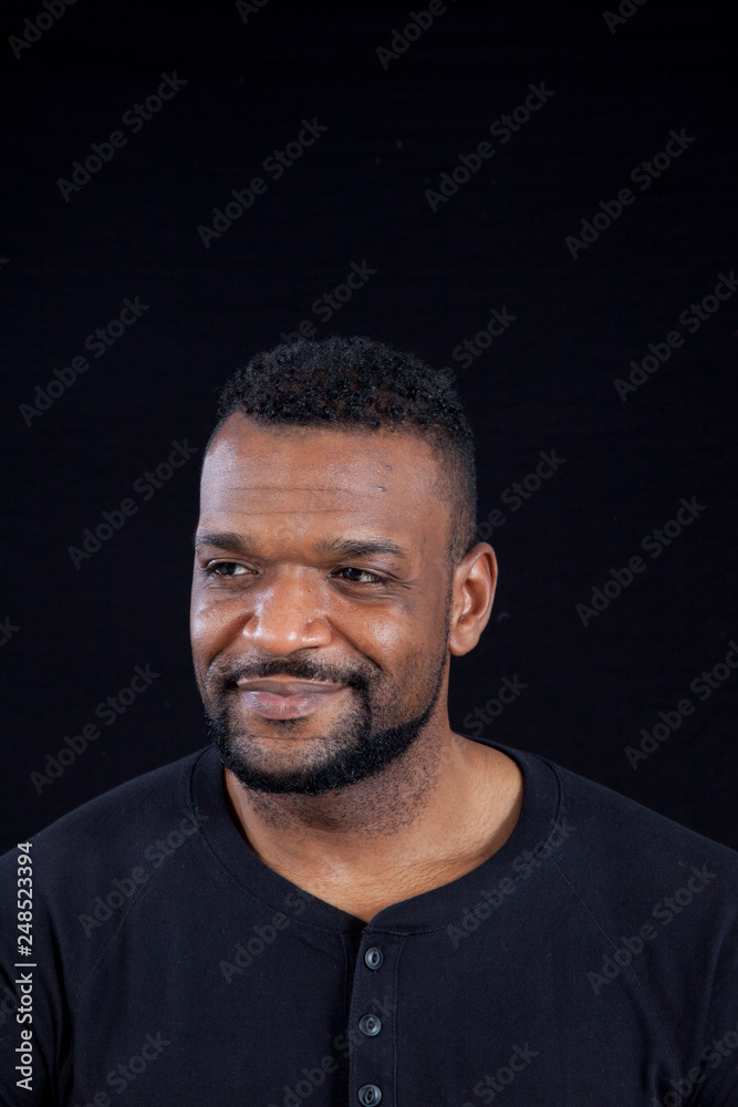 Smiling Black man in black shirt