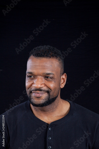 Smiling Black man in black shirt