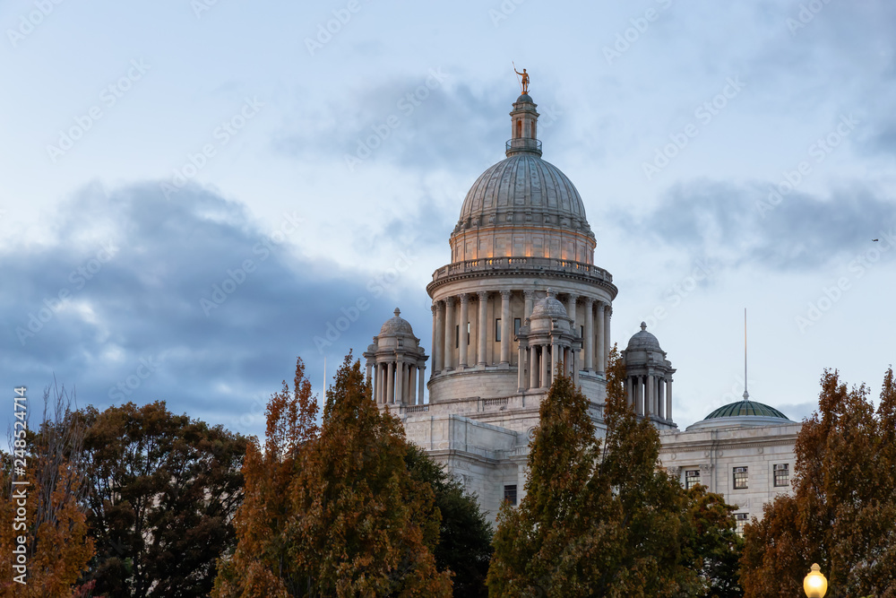 View of Rhode Island State House during a vibrant sunset. Located in Downtown Providence, Rhode Island, United States.