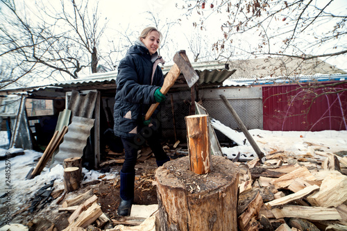 Girl chopping wood