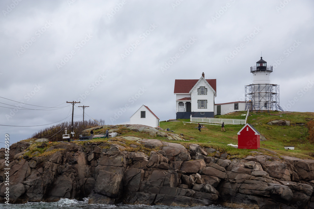 York, Maine, United States - October 24, 2018: Nubble Lighthouse being renovated at an off season.