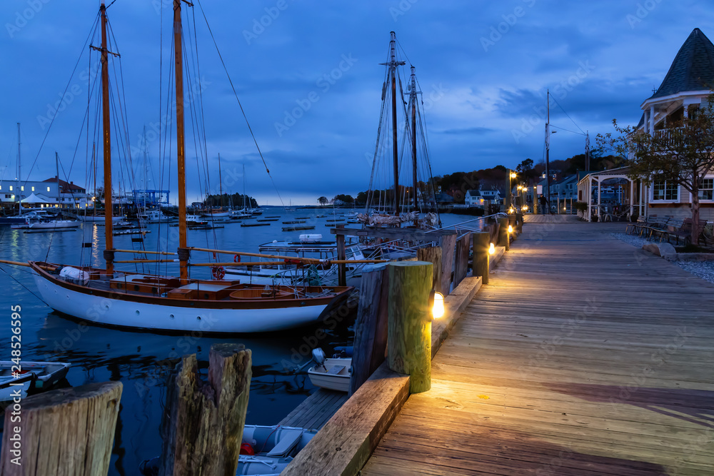 Fototapeta premium Beautiful view on the marina during a cloudy sunrise. Taken in Camden, Maine, United States.