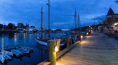 Beautiful panoramic view on the marina during a cloudy sunrise. Taken in Camden, Maine, United States. photo