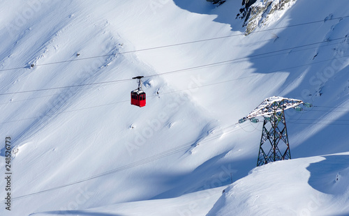 Cable car in winter alpine landscape