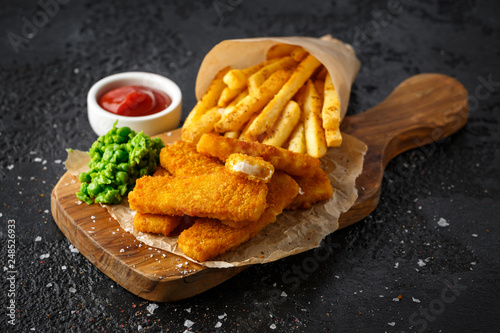 Fish fingers, mashed peas and chips fries. Traditional British fast food