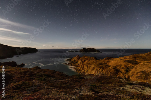 Striking seascape view on a rocky Atlantic Ocean Coast during night time. Taken at Crow Head, North Twillingate Island, Newfoundland and Labrador, Canada. © edb3_16