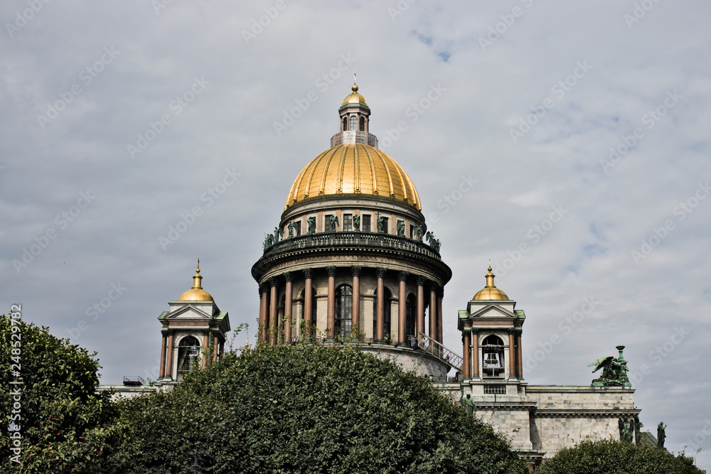 Saint Isaac's Cathedral in St. Petersburg with bushes, Russia. Saint Isaac's Cathedral in St. Petersburg with bushes, Russia.