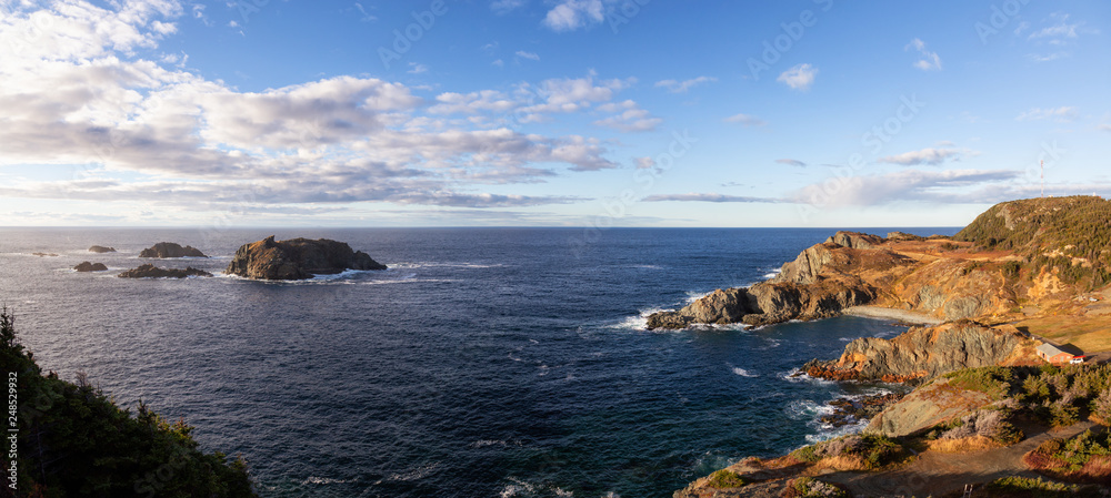 Striking panoramic seascape view on a rocky Atlantic Ocean Coast during a vibrant sunset. Taken at Crow Head, North Twillingate Island, Newfoundland and Labrador, Canada. - obrazy, fototapety, plakaty 