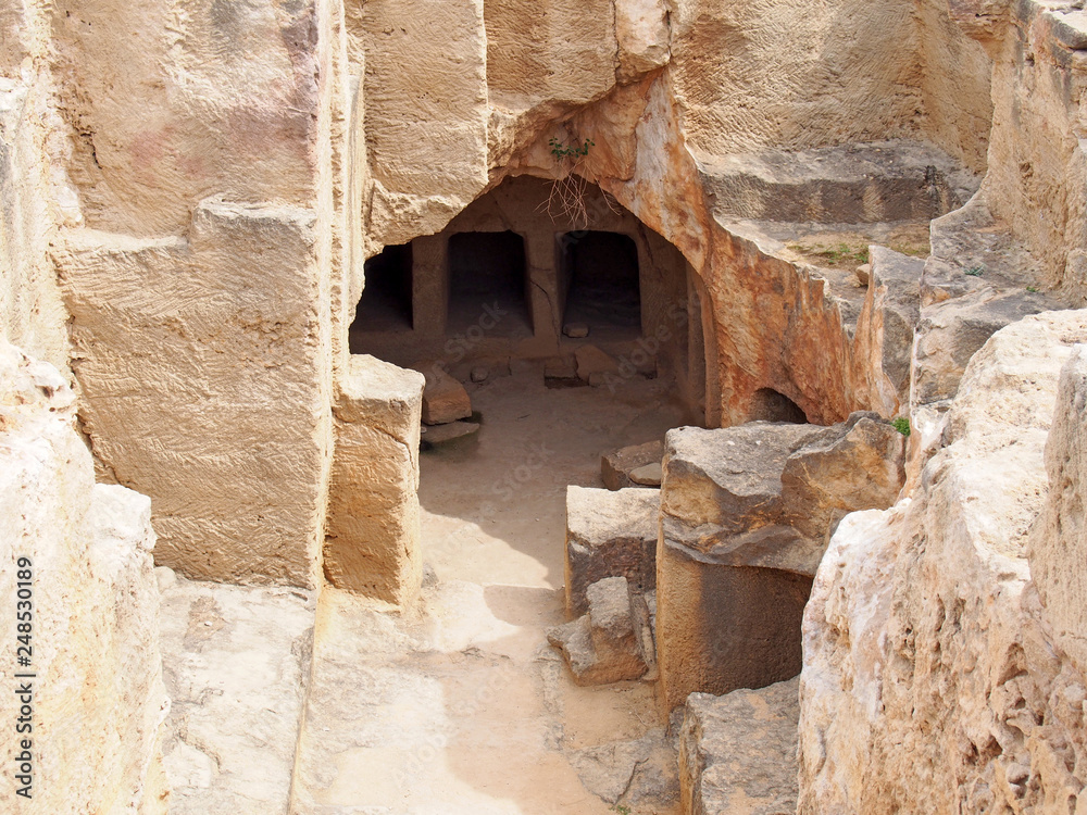 carved entrance to underground catacombs at the tomb of the kings in paphos cyprus