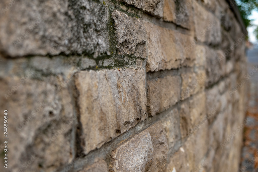 old stone wall at a street with text space old stone wall at a street with text space