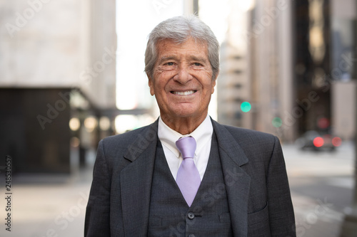 Senior businessman in city walking smile happy face