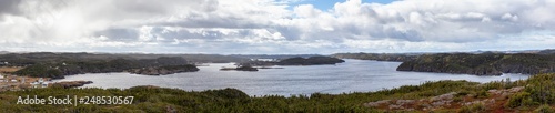 Panoramic View of a Canadian Landscape on the Atlantic Ocean Coast during a cloudy morning. Taken in Pikes Arm, Newfoundland and Labrador, Canada.