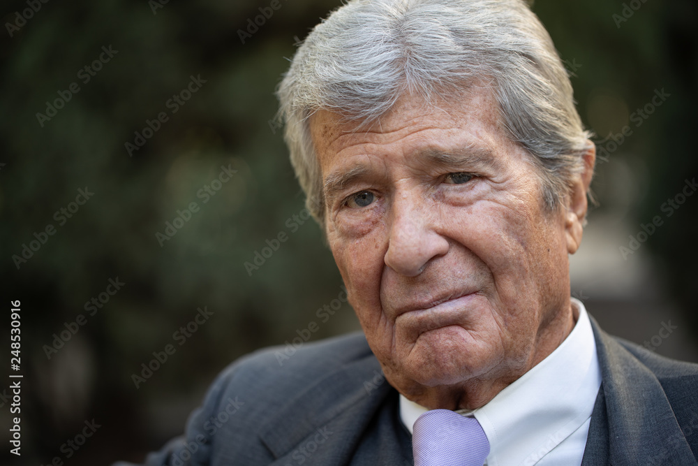 Senior businessman in city serious angry face Senior businessman in city serious angry face