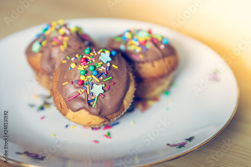 Homemade sweet tasty muffins with colourful decoration
