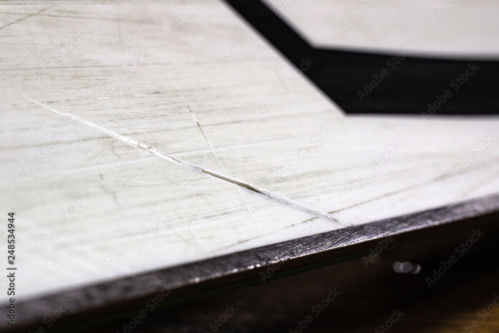 scratches on the sliding surface of the snowboard close-up scratches on the sliding surface of the snowboard close-up