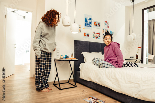 Friend feeling embarrassed after taking clothes of her roommate photo