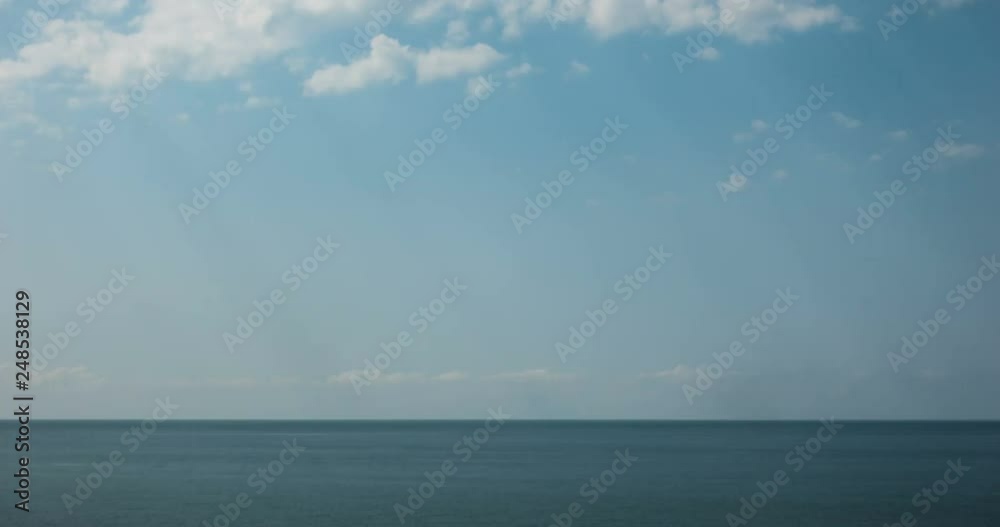 Sea view on the nice summer day, clean blue water and smooth waves, blue sky with clouds, horizon line. Sea, ocean, nature timelapse video background. Sea view on the nice summer day, clean blue water and smooth waves, blue sky with clouds, horizon line. Sea, ocean, nature timelapse video background.