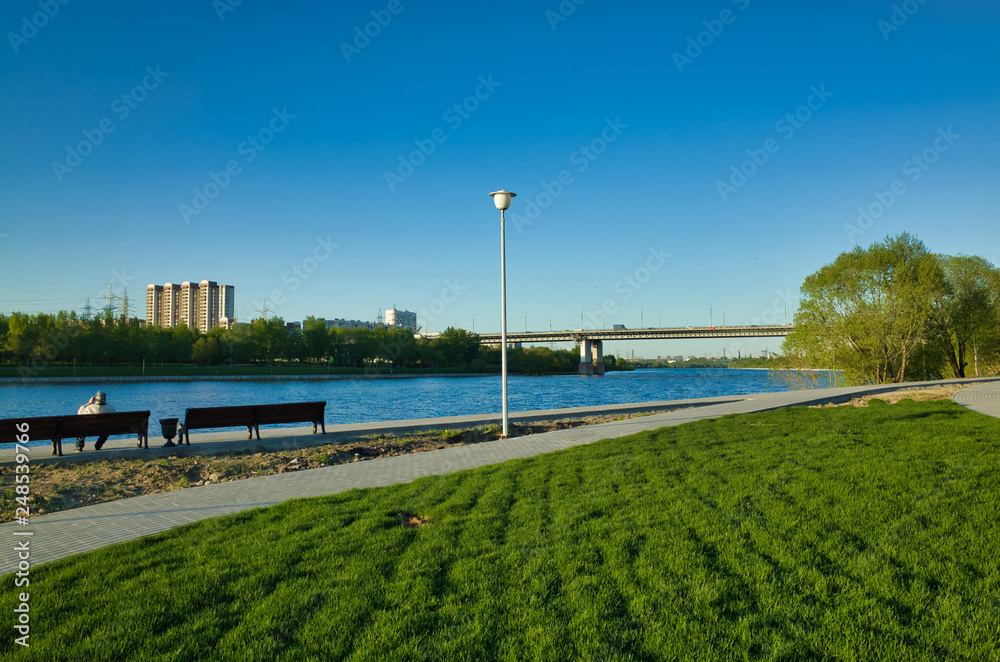 MOSCOW, RUSSIA - MAY 10, 2018: Brateevsky Park. Place of recreation and entertainment, view of the bridge across the Moscow River
