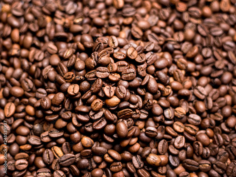 Coffee Background. roasted coffee beans, top view, Represent breakfast, energy, freshness or great aroma Coffee Background. roasted coffee beans, top view, Represent breakfast, energy, freshness or great aroma